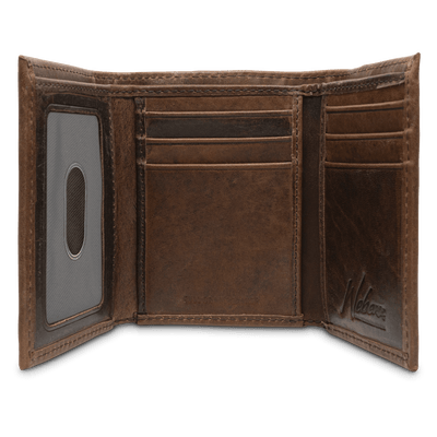 A classic for anyone's collection, the Dynasty Trifold Shotshell Wallet comes with a beautiful hand-oiled finish within a premier full grain leather. The signature shotshell concho makes it the perfect piece for any outdoor enthusiast. Don't miss out! 6 Card Slots 2 Storage Pockets 1 ID Window Leather Tipped Bill Compartment Dimensions: 3.37"L x 4"H RFID Protection Color: Brown