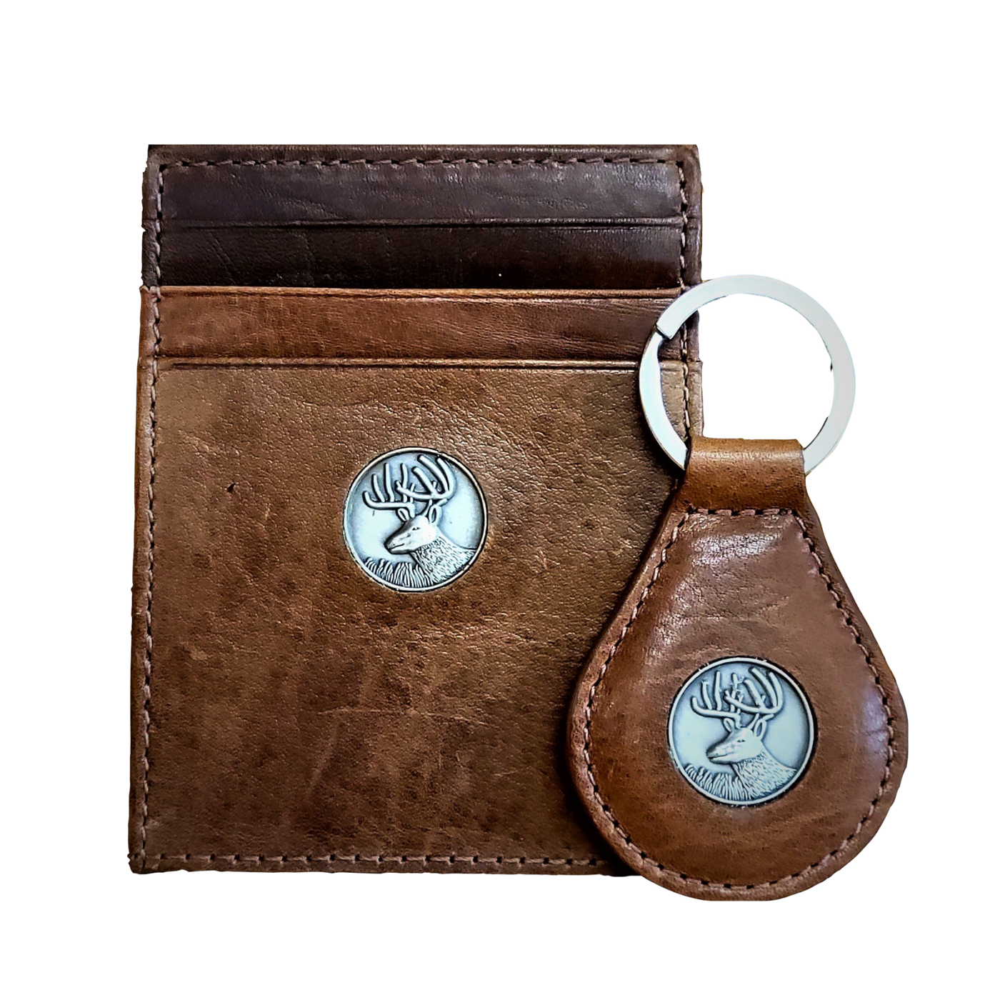 The perfect gift, the Dynasty Bifold Buck Wallet & Keyring is constructed from premier full grain leather and has a hand-oiled stylish finish. Beautiful pieces for your collection. 6 Card Slots 2 Storage Pockets 1 ID Window Exterior Easy Access Pocket Strong Exterior Money Clip Slim Minimalist Design Weber's Signature Buck Concho Money Clip Holds: 10+ Bills Dimensions: 4.2"L x 3"H RFID Protection Color: Brown