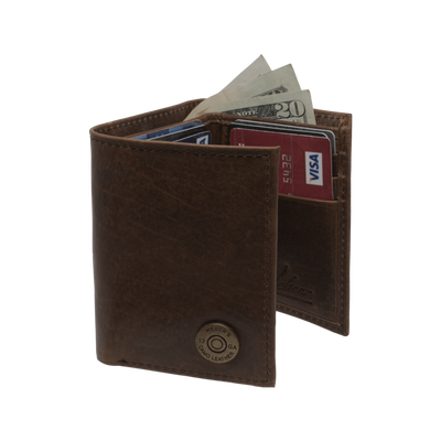 A classic for anyone's collection, the Dynasty Trifold Shotshell Wallet comes with a beautiful hand-oiled finish within a premier full grain leather. The signature shotshell concho makes it the perfect piece for any outdoor enthusiast. Don't miss out! 6 Card Slots 2 Storage Pockets 1 ID Window Leather Tipped Bill Compartment Dimensions: 3.37"L x 4"H RFID Protection Color: Brown