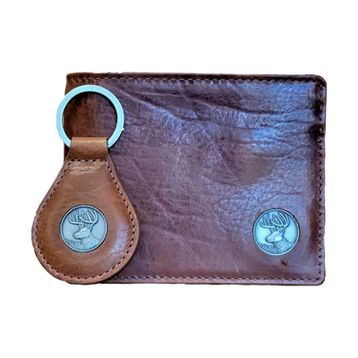 The Dynasty Bifold Buck Wallet & Keyring, harnesses the hunt for any avid outdoorsman. The premier full grain leather and hand-oiled stylish finish set this among the top for stocking stuffers. Don't miss out! 8 Card Slots 2 Storage Pockets Leather Tipped Bill Divider Signature Buck Concho Dimensions: 4.5"L x 3.5"H RFID Protection Color: Brown