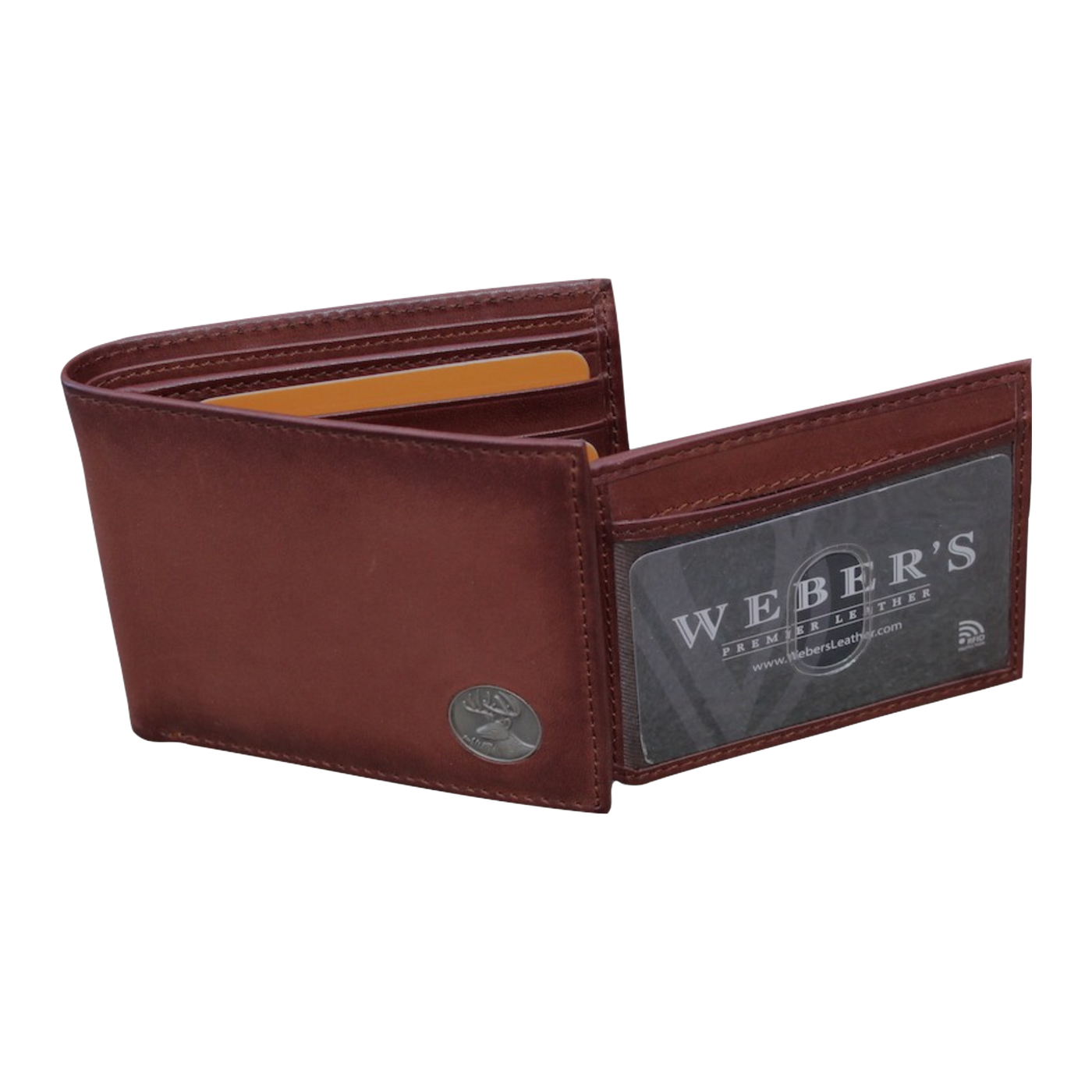 Our Wildlife Bifold Buck Wallet is the perfect piece for any collection, containing a beautiful hand-burnished finish and rich full grain leather, this piece doesn't disappoint. 8 Card Slots 3 Storage Pockets 2 ID Windows Leather Tipped Bill Compartment Weber's Signature Buck Concho Dimensions: 4.5"L x 3.5"H RFID Protection Color: Caramel