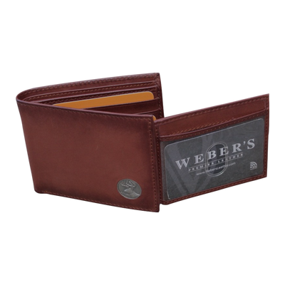 Our Wildlife Bifold Buck Wallet is the perfect piece for any collection, containing a beautiful hand-burnished finish and rich full grain leather, this piece doesn't disappoint. 8 Card Slots 3 Storage Pockets 2 ID Windows Leather Tipped Bill Compartment Weber's Signature Buck Concho Dimensions: 4.5"L x 3.5"H RFID Protection Color: Caramel