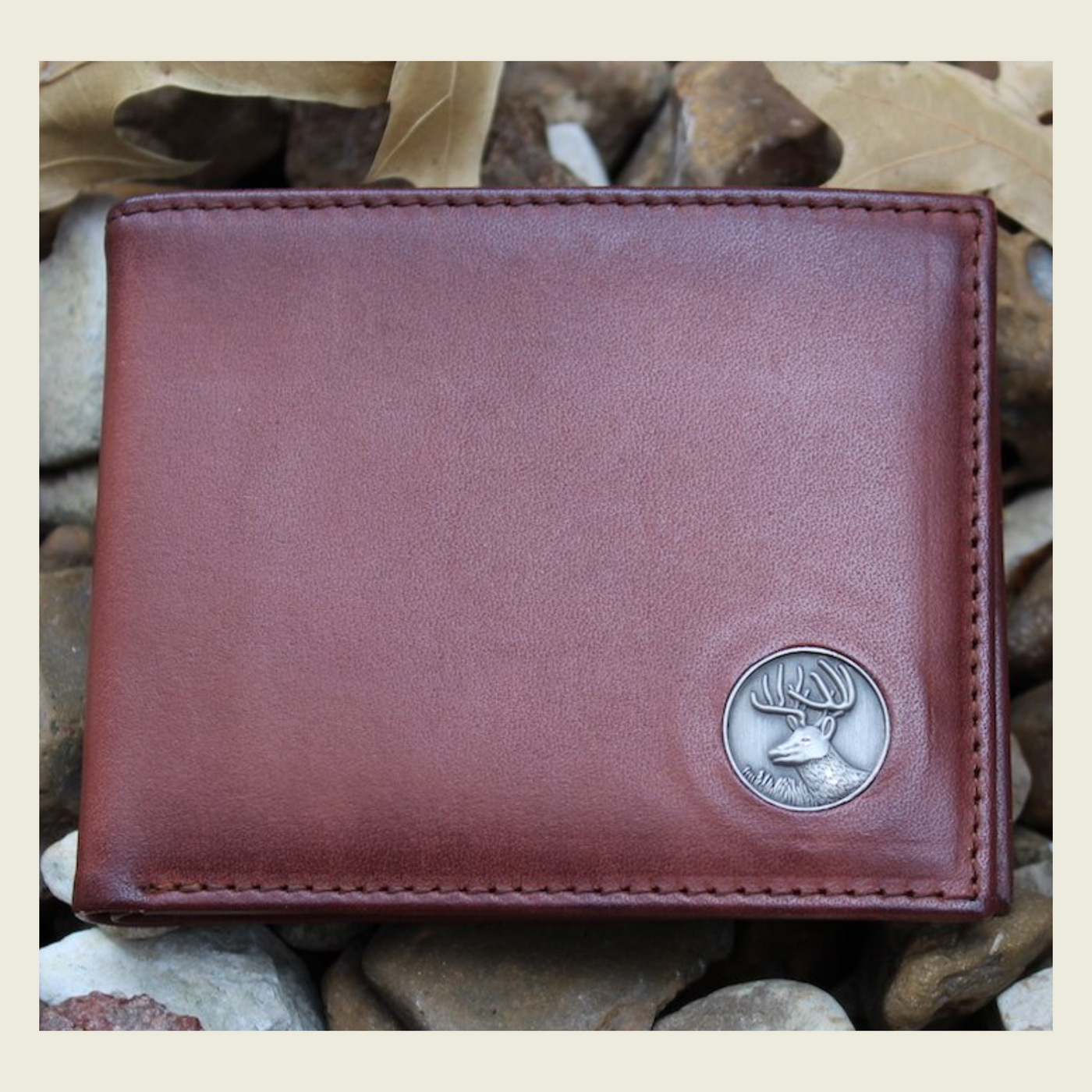 Our Wildlife Bifold Buck Wallet is the perfect piece for any collection, containing a beautiful hand-burnished finish and rich full grain leather, this piece doesn't disappoint. 8 Card Slots 3 Storage Pockets 2 ID Windows Leather Tipped Bill Compartment Weber's Signature Buck Concho Dimensions: 4.5"L x 3.5"H RFID Protection Color: Caramel