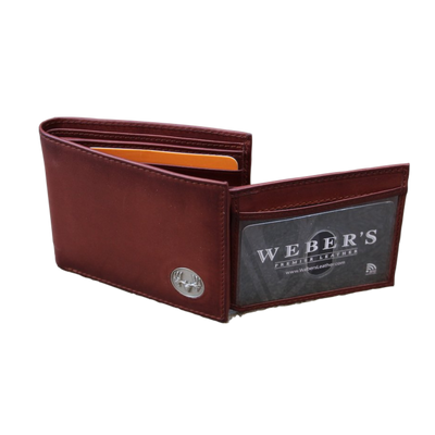 What hunter wouldn't enjoy the Wildlife Bifold European Mount Wallet for their collection? This piece is classic in style with its hand-burnished, rich full grain leather and the European mount concho. Ensure to get yours today! 8 Card Slots 3 Storage Pockets 2 ID Windows Leather Tipped Bill Compartment Dimensions: 4.5"L x 3.5"H RFID Protection Color: Caramel