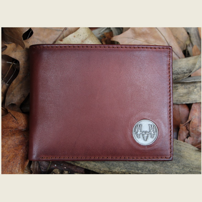 What hunter wouldn't enjoy the Wildlife Bifold European Mount Wallet for their collection? This piece is classic in style with its hand-burnished, rich full grain leather and the European mount concho. Ensure to get yours today! 8 Card Slots 3 Storage Pockets 2 ID Windows Leather Tipped Bill Compartment Dimensions: 4.5"L x 3.5"H RFID Protection Color: Caramel